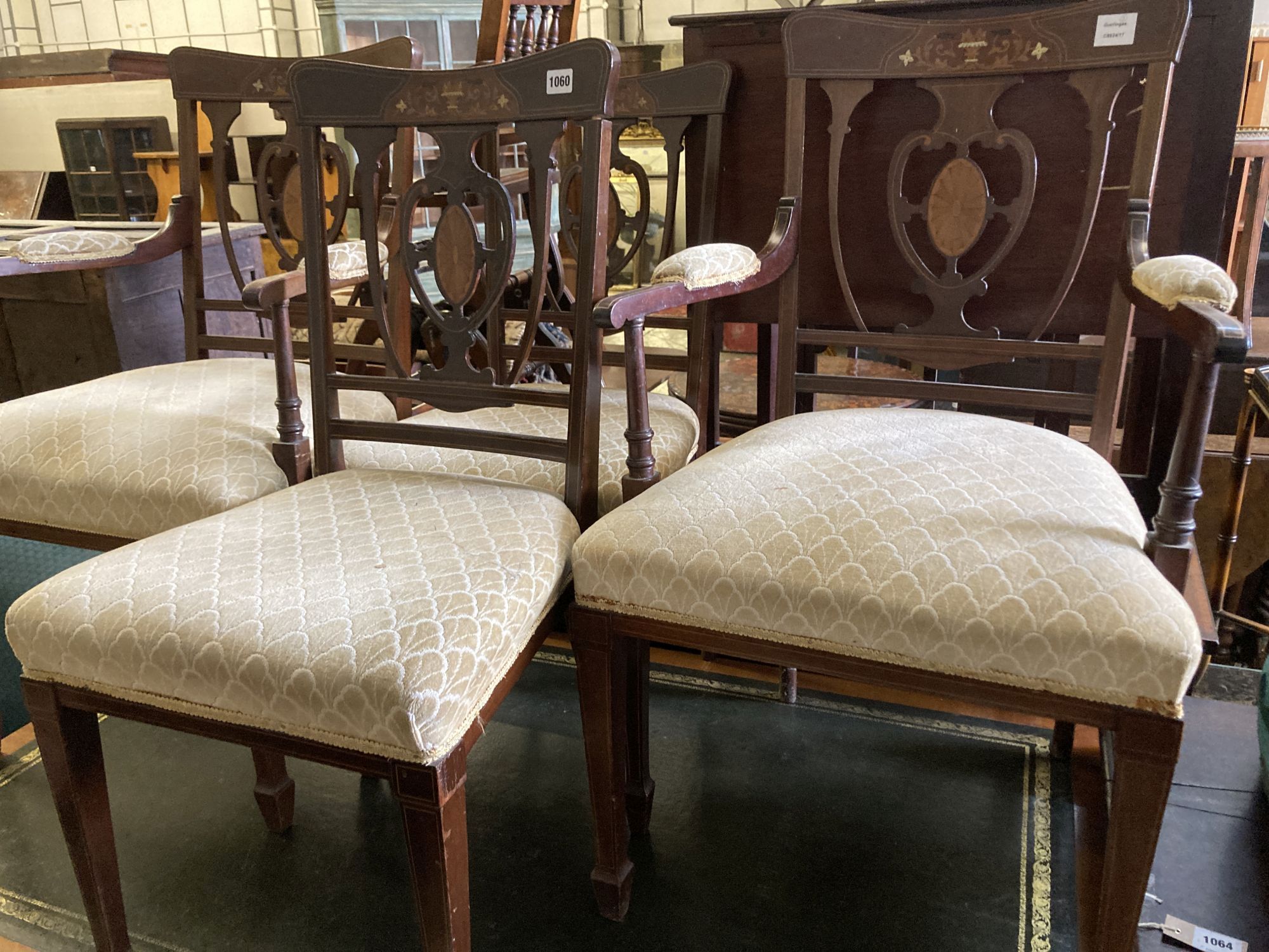 A pair of Edwardian inlaid mahogany elbow chairs and two matching single chairs